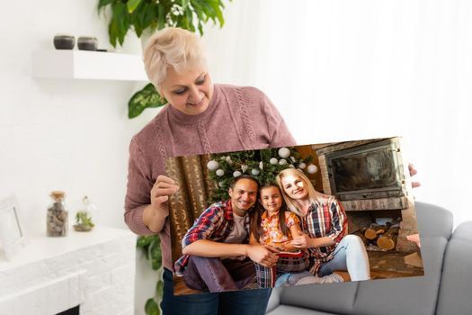 woman holding a photography with gallery stretch on a wooden frame. Printed photo on canvas.