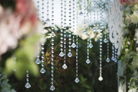 beautiful wedding ceremony in the park. crystal drops.