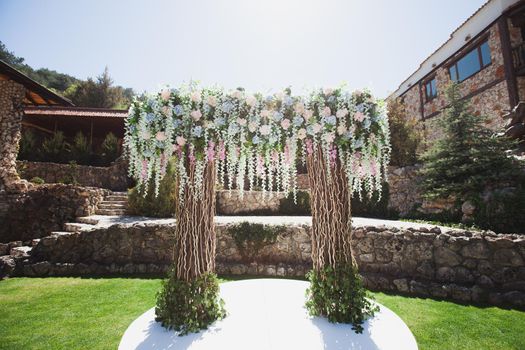 Outdoor wedding ceremony decoration at the hotel.