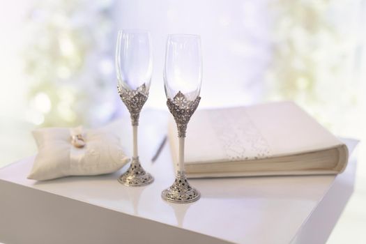 Wedding glasses with champagne on the table.