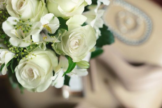 Delicate wedding bouquet of white flowers close-up