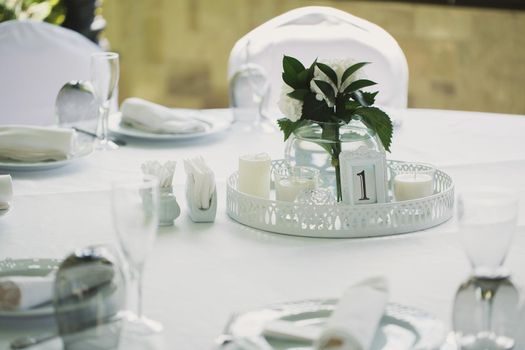 Beautifully decorated tables for guests with decorations.