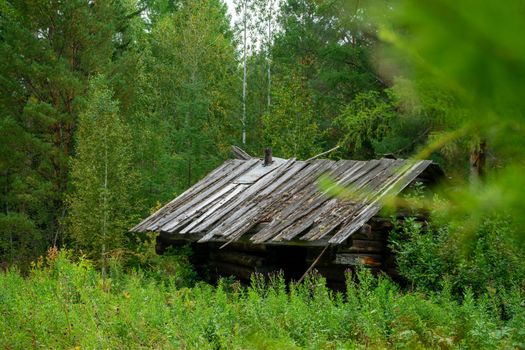 hunting lodge in Siberia. an old abandoned wooden house in the taiga.