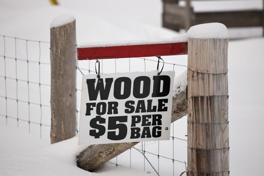 A Firewood for Sale Sign in a rural setting