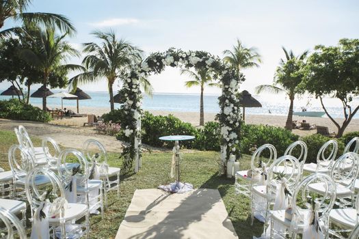 Romantic wedding ceremony on the beach near the ocean