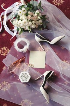 Elegant wedding accessories of the bride in the morning on the day of the celebration.
