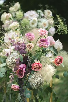 Details. Wedding ceremony in the open air of fresh flowers. Gentle and beautiful wedding decor for newlyweds