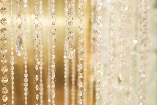 Hanging glass and shiny beads are an element of the wedding decor