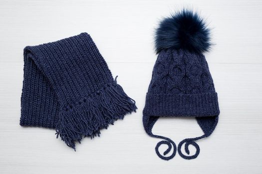 Winter children's knitted hat and scarf in blue.