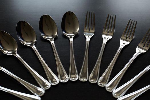 Cutlery on a black background. Fork, spoon, knife