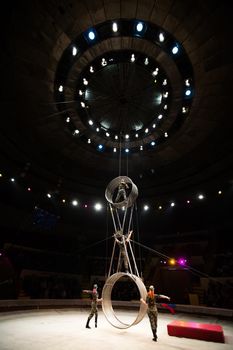 acrobats in the circus perform a complex trick.