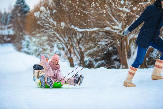 Family of dad and kids vacation on Christmas eve outdoors