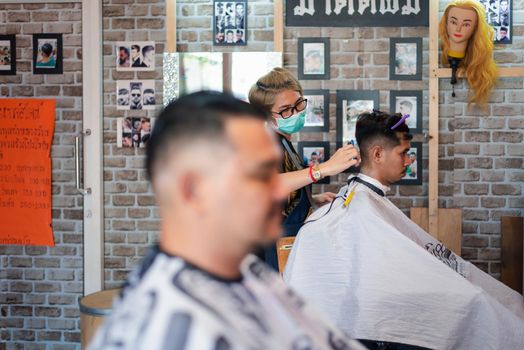 Hairstyle or barber haircut customer at barbershop