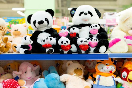 Sale of soft plush toys on the supermarket counter.