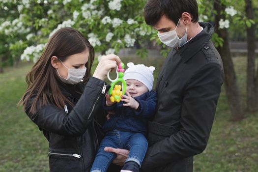 Family wearing protective medical mask for prevent virus Covid-19.