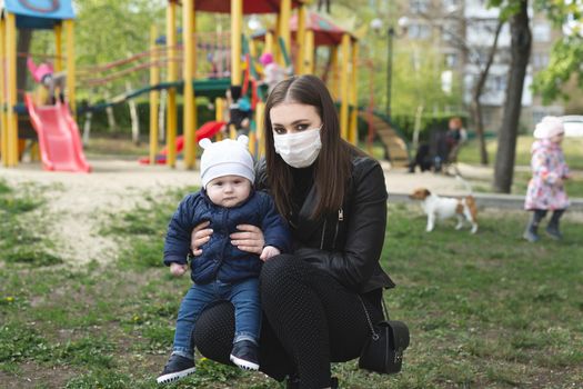 Portrait of a woman and her son in a protective mask against the crown virus or an outbreak of the covid-19 and pm 2.5 virus in the city.