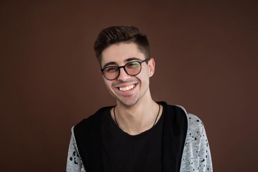Portrait of laughing young man. Happy guy smiling
