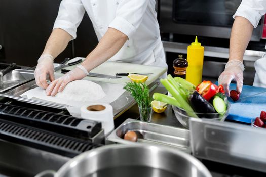 Chefs prepare delicious dishes in the kitchen
