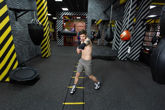 A male athlete trains in the gym