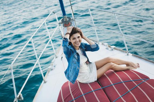 Attractive girl on a yacht at sea
