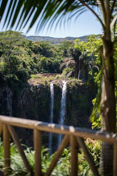 Waterfall flows into the crater of the volcano in Mauritius. National Park Chamarel
