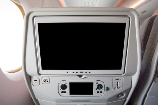 Airplane seat back, LCD screen, entertainment during the flight