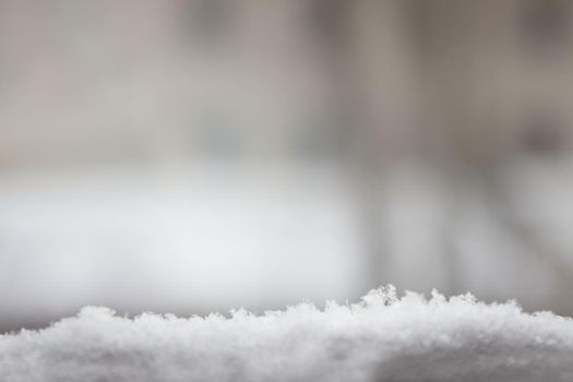 Winter banner with snow and blurred background. Selective focus. Winter banner or poster. Copy space.