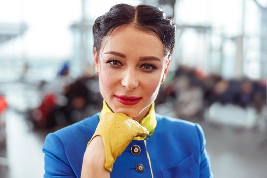 Female airline worker standing in airport terminal