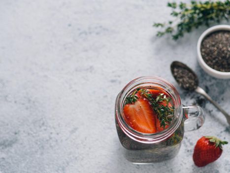 strawberry and thyme chia water in mason jar