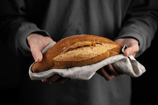 Holding loaf of Jerusalem artichoke sunchoke bread