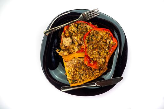 black dish with gratinated peppers