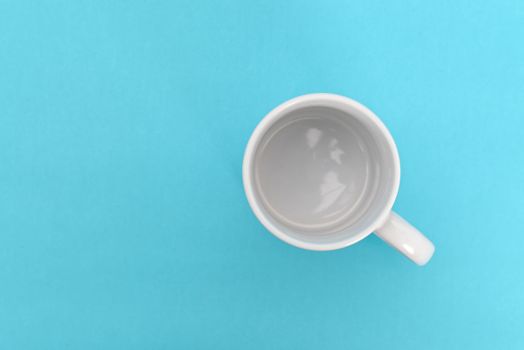 White mug on a blue background