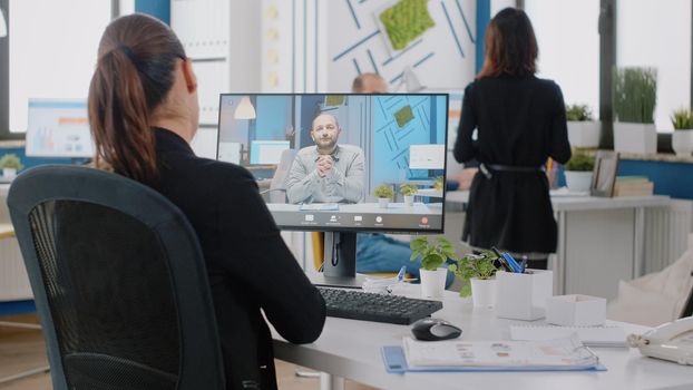 Businesswoman using video call on computer for conversation