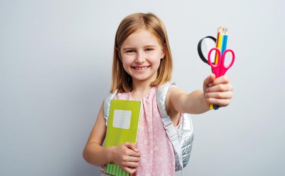 Schoolgirl with stationery supplies