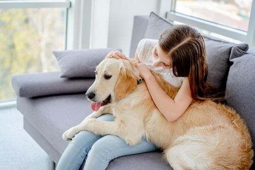Sweet girl holding cute dog