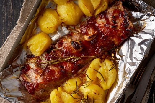 Spicy barbecue pork ribs and crushed smashed potatoes. Slow cooking recipe.