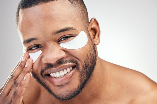Personal grooming boosts your confidence. Studio portrait of a handsome young man wearing under-eye patches against a white background.