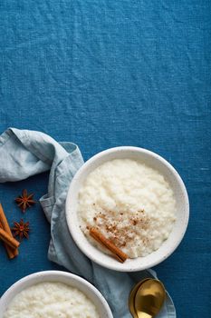 Rice pudding. French milk rice dessert. Top view, vertical, copy space