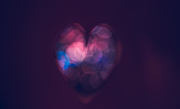 Conceptual Image of Love. Dark Purple Bokeh Style Heart. Abstract Holiday Background. Happy Valentine's Day. Greeting Card for Lovers.