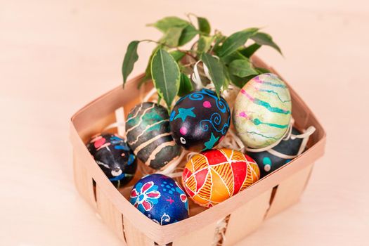 Easter basket with painted eggs. Easter holiday tradition.