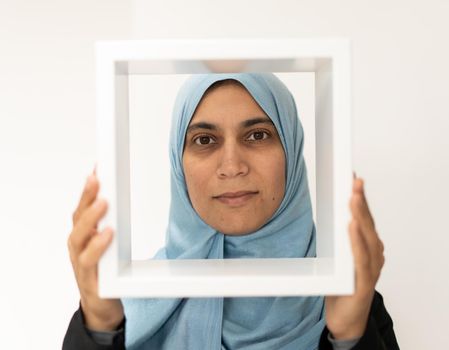 Pretty Muslim Arabic woman with a frame