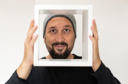 Happy mid aged man with white frame