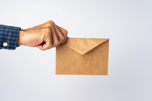 Male hands holding an envelope with a wax seal