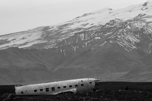 Wreck of and airplane profile and mountains