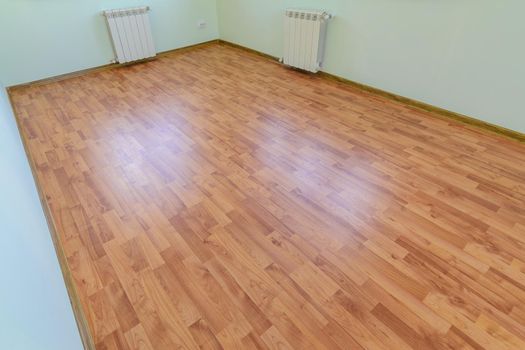 Laminate on the floor of the room after renovation in the apartment
