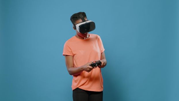 Portrait of casual person using vr glasses and controller