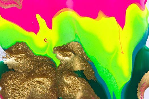 Abstract liquid ink gradient pattern with gold dust. Fluorescent liquid bright texture.