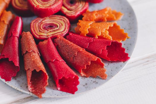 Fruit rolls pastille. Apple candy rolls, chips. Shredded and dried fruits. Useful sweetness. Food dessert. Homemade snack. Degidrated fruits. Natural and healthy, Sugar-Free, nutrition