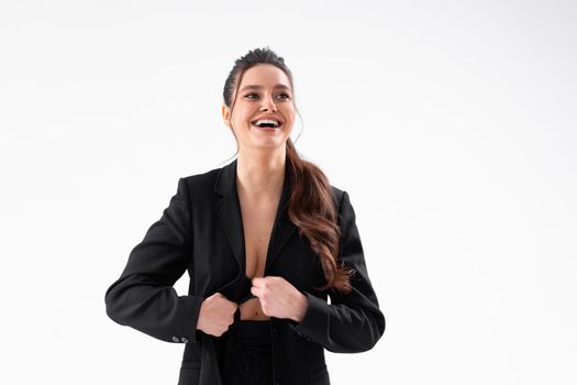 Young business woman arms crossed in black jacket standing studio isolated on white background