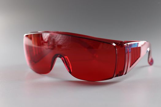 Red plastic safety glasses, protective workwear glasses for foreman worker